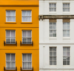 Close-up of yellow residential building
