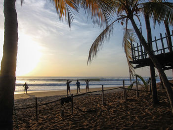 Scenic view of beach against sky during sunset