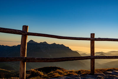 Scenic view of mountains against clear blue sky