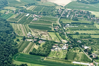 Urban sprawl in the north of germany with small farmland, roads, houses, aerial view
