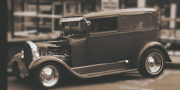 Close-up of vintage car on street