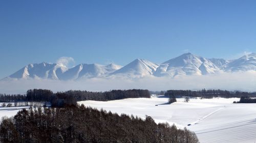 Tranquil view of snowcapped mountains against clear sky