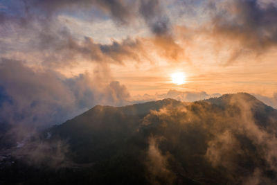 Scenic view of mountains against sky during sunset