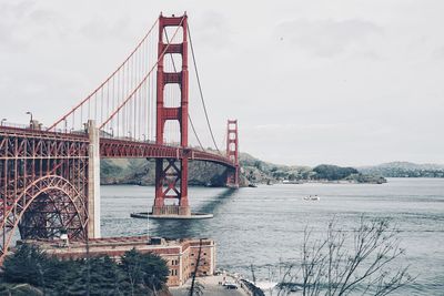 Golden gate bridge over bay against sky