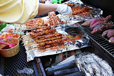 High angle view of preparing food on barbecue grill