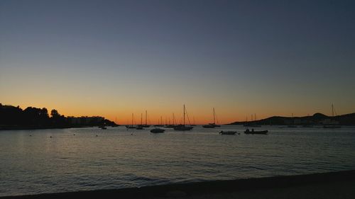 Scenic view of calm sea at sunset