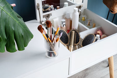 Stylish room interior with elegant dressing table and plants