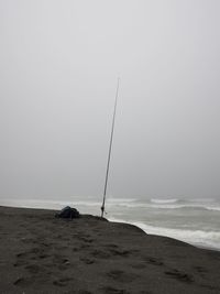Scenic view of beach against clear sky