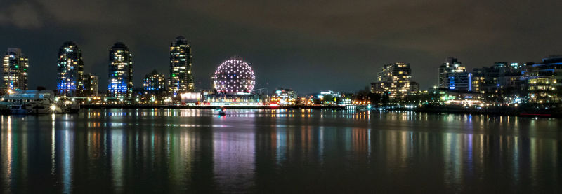 Illuminated buildings at waterfront