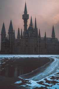 Historic building against sky during winter