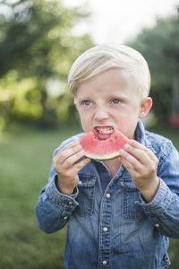 Portrait of boy eating food