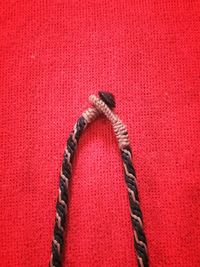 High angle view of ropes on red background