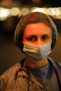 Portrait of young woman wearing mask