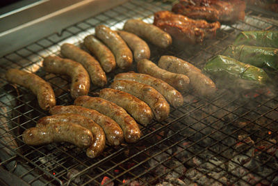 High angle view of meat on barbecue grill