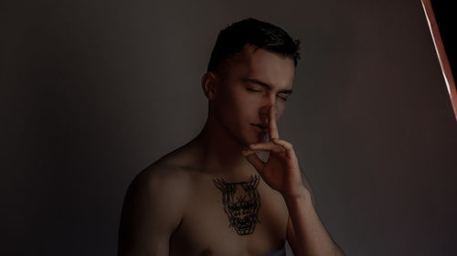 Portrait of young man looking at camera
