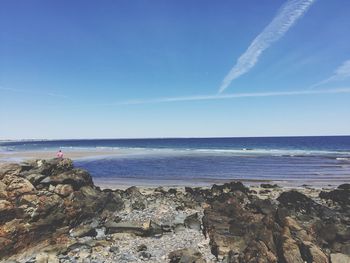 Scenic view of sea against blue sky