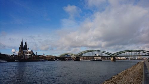 Bridge over river with buildings in background