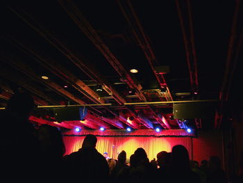 Low angle view of illuminated ferris wheel