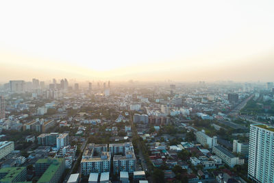 High angle view of buildings against sky during sunset