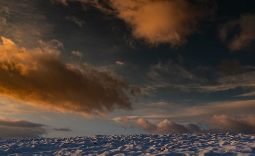 Low angle view of dramatic sky during sunset