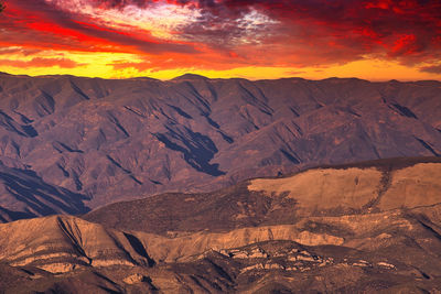 Scenic view of dramatic landscape during sunset