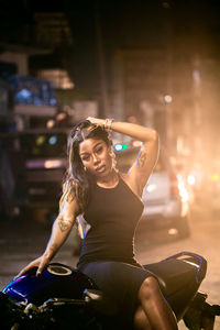 Beautiful lady posing on neon light