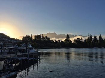 Scenic view of calm lake at sunset