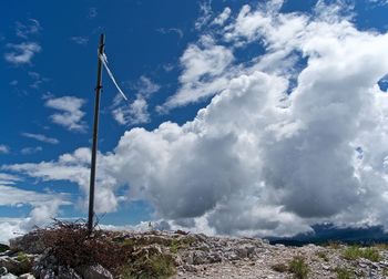 Low angle view of wind turbine against sky