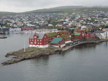 High angle view of river and townscape against sky