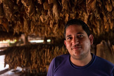 Portrait of young man standing outdoors