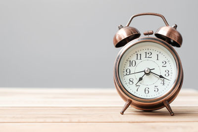 Close-up of clock on table