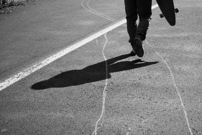 Low section of man standing on ground