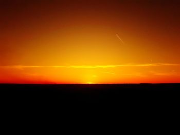 Scenic view of silhouette landscape against sky during sunset