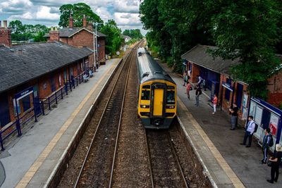 Train on railroad tracks in city