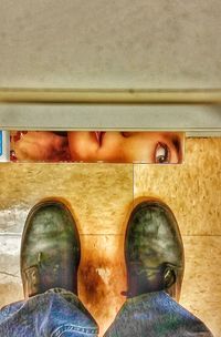 Low section of woman standing on tiled floor