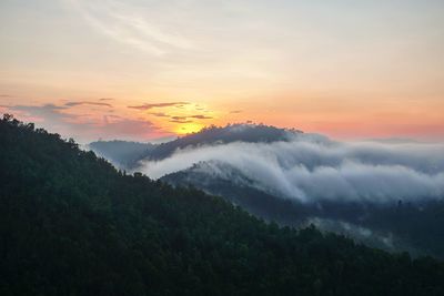 Scenic view of mountains against sky during sunset