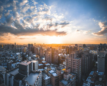 High angle view of buildings against sky during sunset