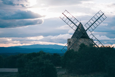 Traditional windmill against sky