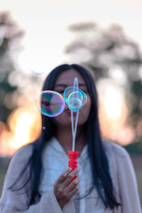 Portrait of woman with bubbles