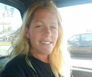 Portrait of a smiling young woman in car