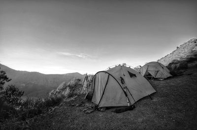 Tent in mountains against sky