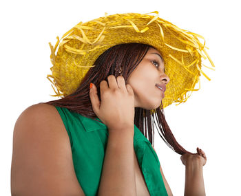 Portrait of beautiful woman against white background