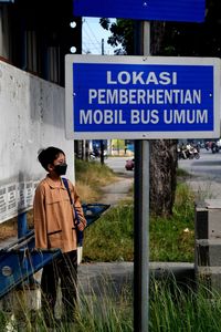 Low angle view of man standing on road