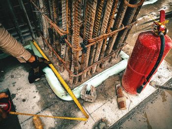 Low section of men working on metal