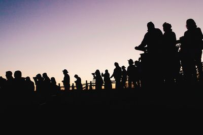 Silhouette people at sunset