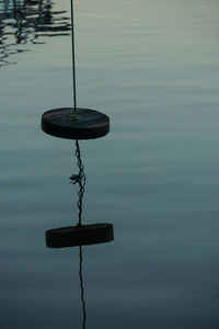 Close-up of lamp post in lake