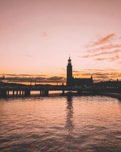 View of bridge over river during sunset