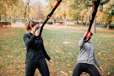 Women exercising at park