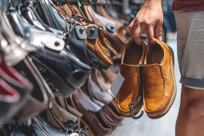 Midsection of man wearing leather shoes