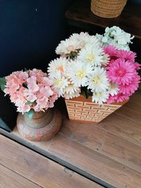 Close-up of pink roses in vase on table